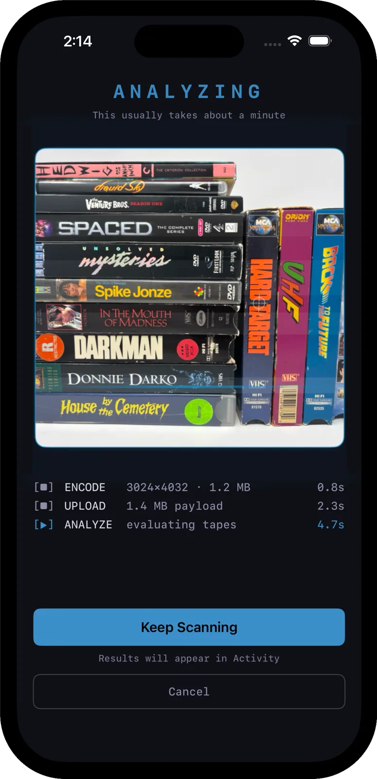 Rewind analyzing a shelf of tapes mid-scan.